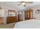 This spacious main bedroom features a ceiling fan, a television, and lots of storage space at 3345 Carmen Ave, Spring Hill, FL 34609