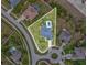Aerial view of a property with a private backyard pool surrounded by lush landscaping in a Gathering friendly neighborhood at 3455 Whispy Ct, Spring Hill, FL 34609