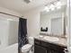 Bathroom featuring a tub, shower, modern vanity and sink, providing a comfortable space at 3455 Whispy Ct, Spring Hill, FL 34609