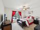 Bright main bedroom with ample natural light, ceiling fan, and a view of the pool area at 3455 Whispy Ct, Spring Hill, FL 34609