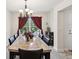 Formal dining area featuring a stylish chandelier and modern decor at 3455 Whispy Ct, Spring Hill, FL 34609