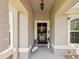 Inviting entryway with decorative accents, flowers, and seasonal decor for a warm welcome at 3455 Whispy Ct, Spring Hill, FL 34609