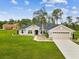 Beautiful single-story home features a well-manicured lawn and attached two-car garage at 3455 Whispy Ct, Spring Hill, FL 34609