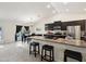 Open-concept kitchen with bar seating and stainless appliances at 3455 Whispy Ct, Spring Hill, FL 34609