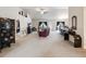 Spacious living room with high ceilings, neutral carpet, and stylish furnishings at 3455 Whispy Ct, Spring Hill, FL 34609