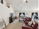 Inviting living room featuring a fireplace, a TV, and comfortable seating at 3455 Whispy Ct, Spring Hill, FL 34609