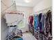 Walk-in closet with hanging racks for clothing and shoe storage at 3455 Whispy Ct, Spring Hill, FL 34609