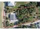 Aerial view of a property with a home, surrounded by lush trees, and beachfront access at 3461 Gum Dr, Weeki Wachee, FL 34607