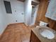 Well-lit bathroom features a granite-topped vanity, shower, and tile floors at 3461 Gum Dr, Weeki Wachee, FL 34607