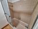Bathroom shower with tile surround and sliding glass doors at 3461 Gum Dr, Weeki Wachee, FL 34607