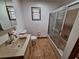 Bathroom with shower, toilet, sink, vanity and tile flooring at 3461 Gum Dr, Weeki Wachee, FL 34607