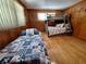 Bedroom featuring a twin bed, bunk bed, and nautical themed bedding at 3461 Gum Dr, Weeki Wachee, FL 34607