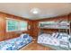 Bedroom featuring a twin bed, bunk bed, and nautical themed bedding at 3461 Gum Dr, Weeki Wachee, FL 34607