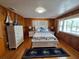 Charming bedroom with wood paneled walls, nautical decor, and lots of natural light at 3461 Gum Dr, Weeki Wachee, FL 34607