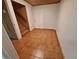 Tiled entryway featuring stairs and a white front door, offering a welcoming entrance at 3461 Gum Dr, Weeki Wachee, FL 34607