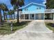 Coastal home with elevated structure, white railings, and beach proximity at 3461 Gum Dr, Weeki Wachee, FL 34607