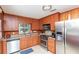 Well-equipped kitchen with stainless steel appliances and wooden cabinetry at 3461 Gum Dr, Weeki Wachee, FL 34607