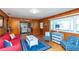 Living room with nautical décor, beach view and wooden paneling at 3461 Gum Dr, Weeki Wachee, FL 34607