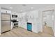 Modern kitchen featuring white shaker cabinets, stainless steel appliances, and tile backsplash at 4035 Fairfield S Ave, St Petersburg, FL 33711