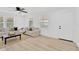 Bright living room with natural light, neutral tones and light wood flooring at 4035 Fairfield S Ave, St Petersburg, FL 33711