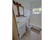 Bathroom featuring a vanity, toilet, and a shower-tub combination with white tile at 4118 Flamingo Dr, New Port Richey, FL 34652