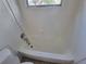 Close up on the white tiled bathtub at 4118 Flamingo Dr, New Port Richey, FL 34652
