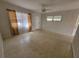 Living room with terrazzo floors, curtains, and a ceiling fan at 4118 Flamingo Dr, New Port Richey, FL 34652