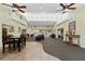 Spacious clubhouse with comfortable seating, tile flooring, and ample natural light at 4335 Canongate Ct, Spring Hill, FL 34609