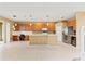 Spacious kitchen with stainless steel appliances, pendant lighting, and ample counter space for cooking and entertaining at 4335 Canongate Ct, Spring Hill, FL 34609