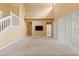 Open living room features a staircase, two story ceilings, neutral walls, and carpeted floors at 4335 Canongate Ct, Spring Hill, FL 34609