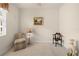 Comfortable carpeted bedroom featuring decorative art and ample sunlight at 4407 Caliquen Dr, Brooksville, FL 34604