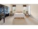 Cozy bedroom featuring neutral carpet, ample natural light and a decorative wardrobe and furnishings at 4407 Caliquen Dr, Brooksville, FL 34604