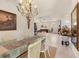 Light-filled dining room showcasing a glass table and chairs, blending traditional design at 4407 Caliquen Dr, Brooksville, FL 34604