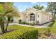 Charming single-story home featuring well-maintained landscaping and a two-car garage at 4407 Caliquen Dr, Brooksville, FL 34604