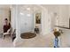 Spacious foyer featuring columns, tile flooring, and high ceilings at 4407 Caliquen Dr, Brooksville, FL 34604