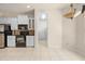 Modern kitchen with white cabinets, granite countertops, and stainless steel appliances at 4407 Caliquen Dr, Brooksville, FL 34604