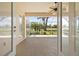 Inviting screened-in lanai with views of a lush lawn and blue skies at 4407 Caliquen Dr, Brooksville, FL 34604
