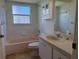 Bathroom with tub, toilet, vanity and updated cabinet at 4450 Anaconda Dr, New Port Richey, FL 34655