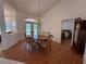 Formal dining room with chandelier, wood floors, and views of the outdoor pool through French doors at 4450 Anaconda Dr, New Port Richey, FL 34655