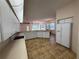 Open-concept kitchen with breakfast bar and views of the dining and living areas at 4450 Anaconda Dr, New Port Richey, FL 34655