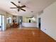 Spacious open-concept living room and kitchen with wood floors and dining area at 4450 Anaconda Dr, New Port Richey, FL 34655