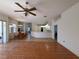 Spacious living room featuring hardwood floors that create a seamless transition into the dining and kitchen areas at 4450 Anaconda Dr, New Port Richey, FL 34655