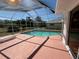 Outdoor pool with screened enclosure and spacious patio area at 4450 Anaconda Dr, New Port Richey, FL 34655