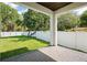 Backyard patio featuring brick pavers, view of lawn and privacy fence at 461 Pent St, Tarpon Springs, FL 34689