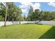 Spacious backyard featuring a privacy fence, and new grass at 461 Pent St, Tarpon Springs, FL 34689