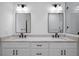 Modern bathroom featuring double sinks, granite countertops, and minimalist black fixtures at 461 Pent St, Tarpon Springs, FL 34689