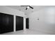 Minimalist bedroom featuring hardwood flooring, modern ceiling fan, and abundant closet space at 461 Pent St, Tarpon Springs, FL 34689