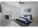 Modern bedroom with large windows providing natural light, a work space and blue decor at 461 Pent St, Tarpon Springs, FL 34689