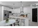 Modern kitchen with stainless steel appliances, white cabinetry, and a stylish island with seating at 461 Pent St, Tarpon Springs, FL 34689