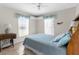 Well-lit bedroom with tiled floors and large windows at 473 Tournament Dr, Spring Hill, FL 34608